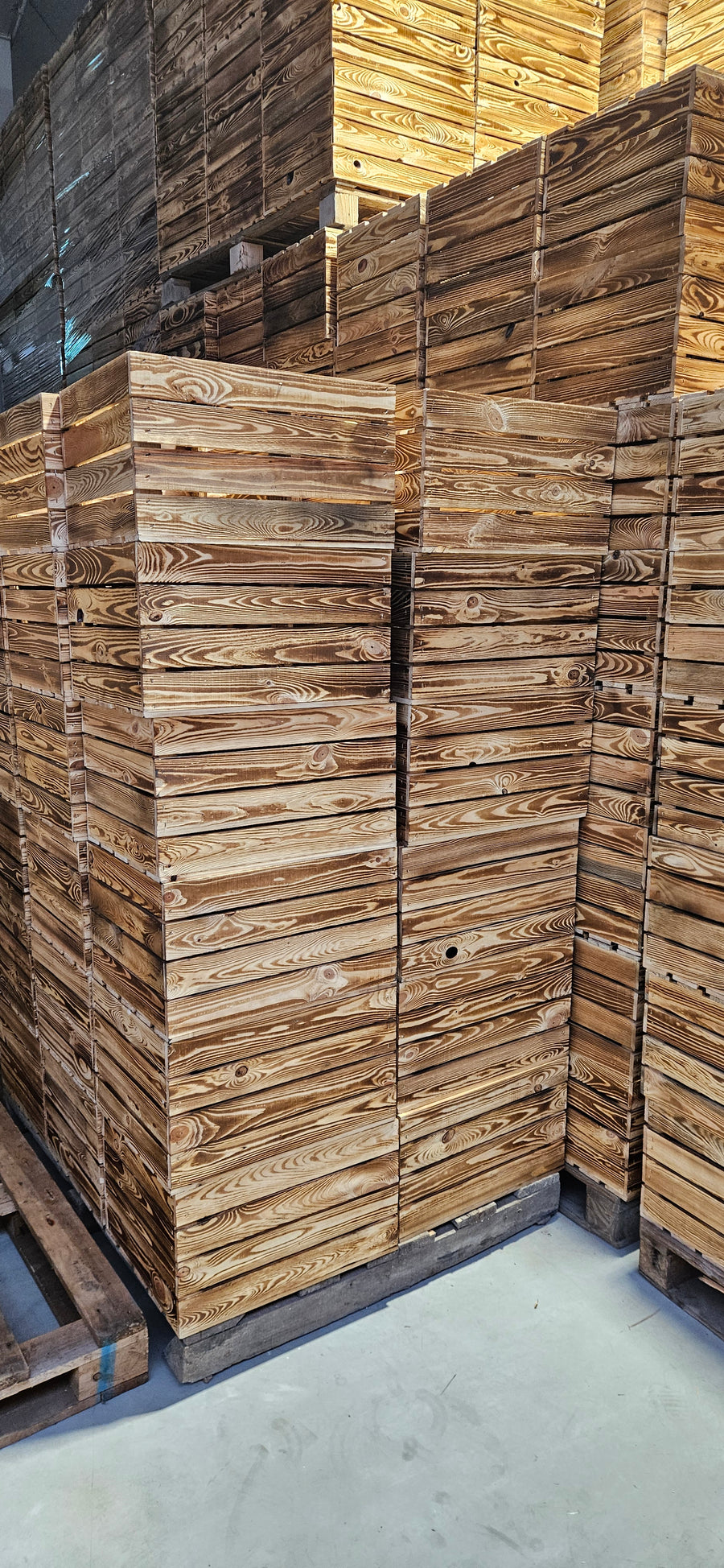 Flame-treated wooden crates in TERAMICO's warehouse